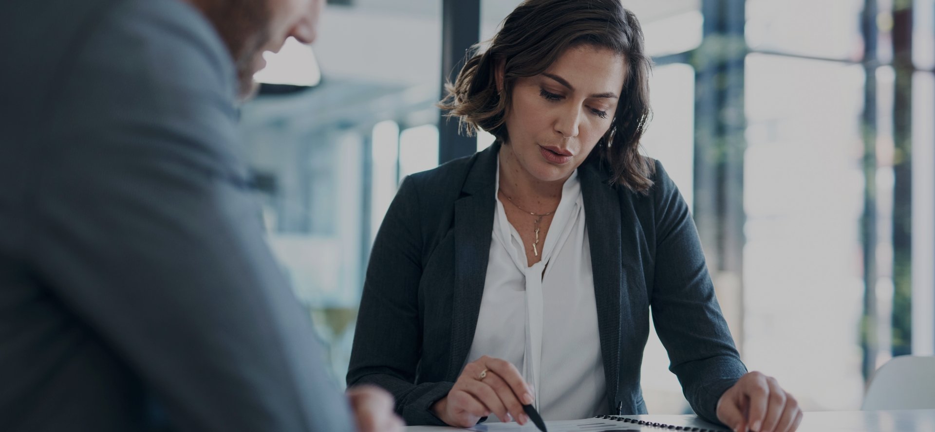 accounting professional woman reviewing notes.